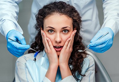 Someone looking shocked in a dental chair